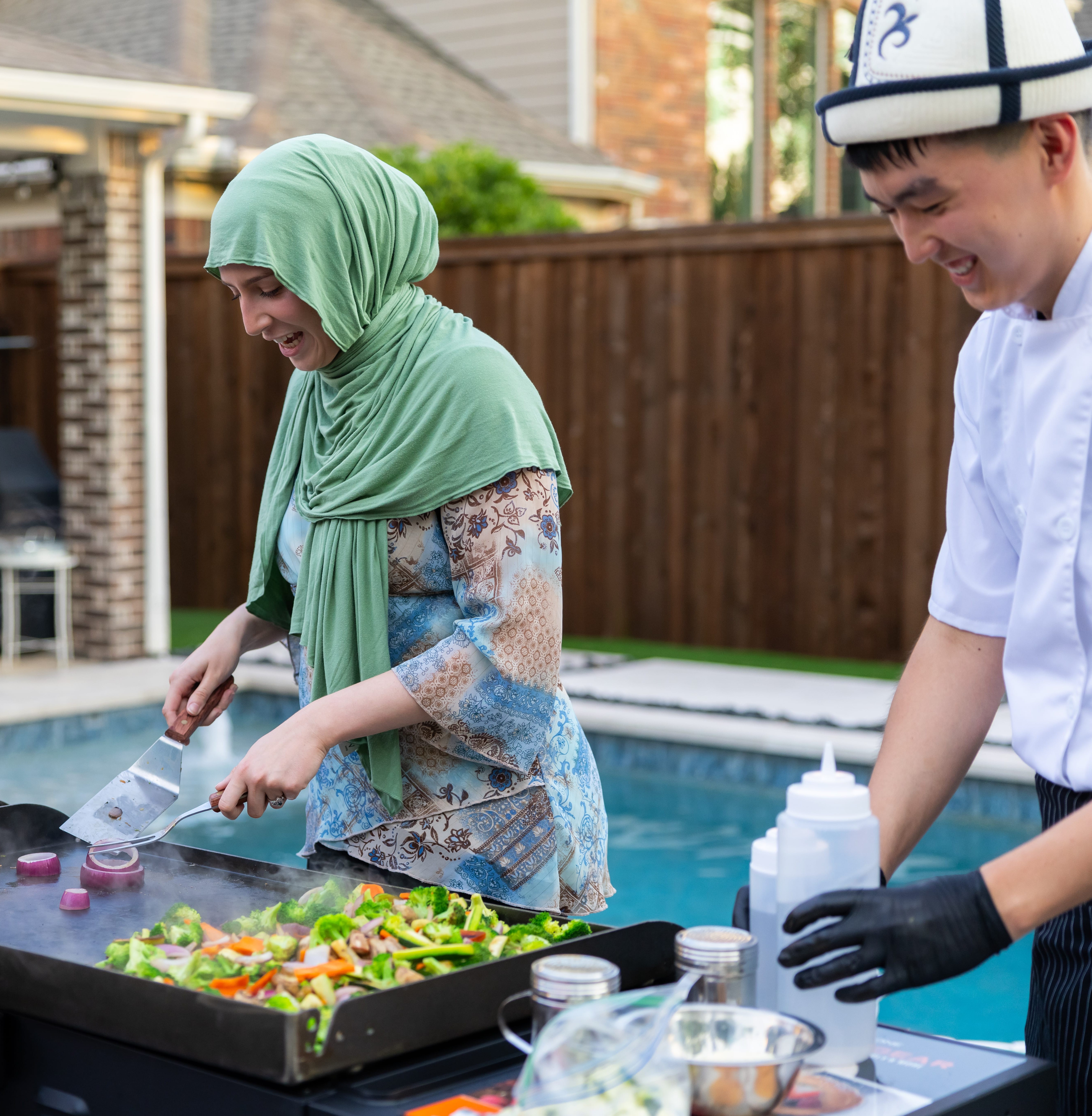 Master chef with traditional hibachi tools and equipment